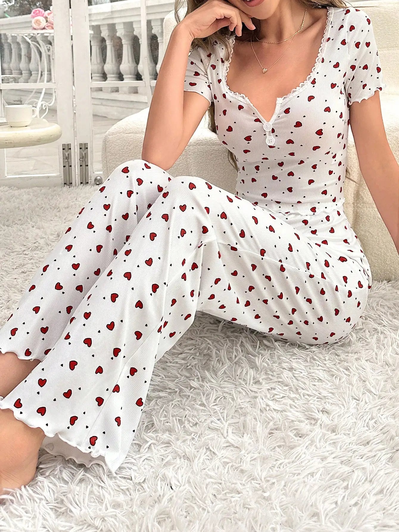 Comfortable pajama set, featuring a heart-shaped printed short sleeved top and elastic waistband with lotus edges, suitable for