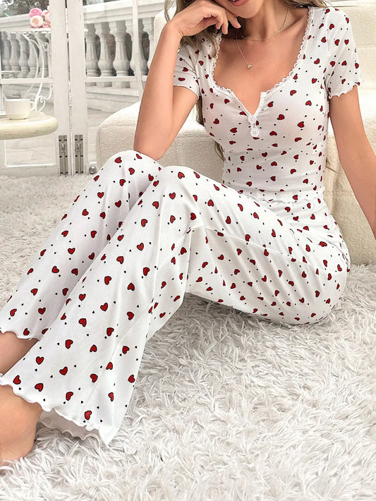 Comfortable pajama set, featuring a heart-shaped printed short sleeved top and elastic waistband with lotus edges, suitable for