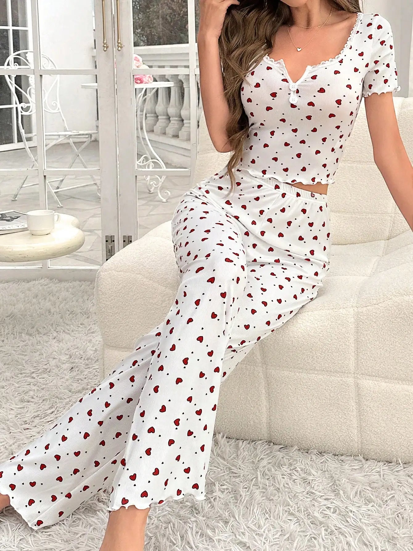 Comfortable pajama set, featuring a heart-shaped printed short sleeved top and elastic waistband with lotus edges, suitable for