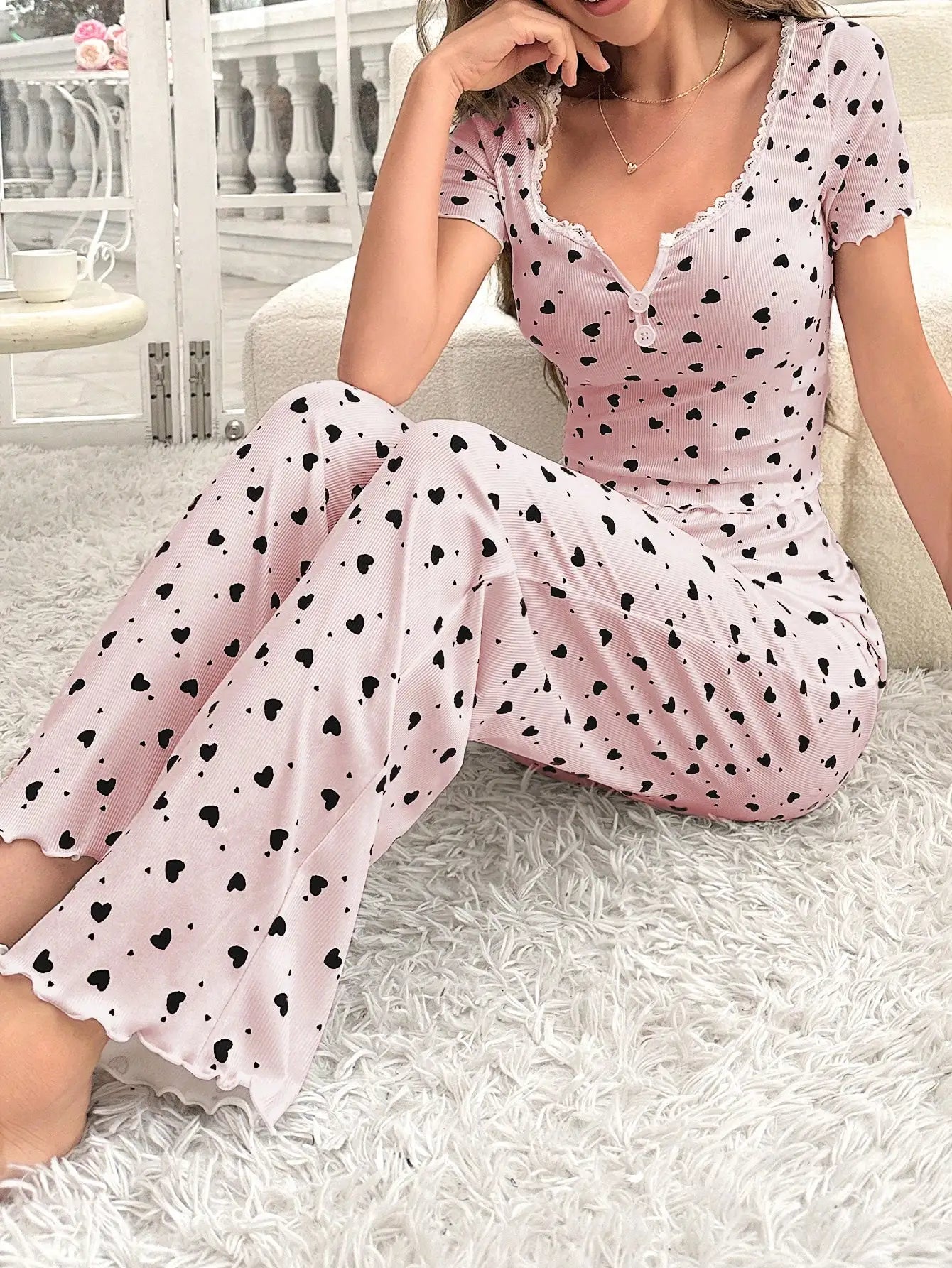 Comfortable pajama set, featuring a heart-shaped printed short sleeved top and elastic waistband with lotus edges, suitable for